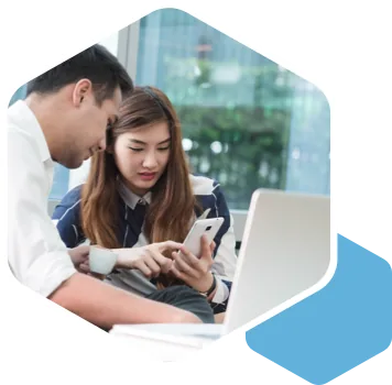Two colleagues reviewing work together